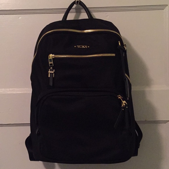tumi black and gold backpack